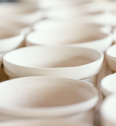 Plain handmade ceramics with soft pastel color toned.Macro shot with soft focus and very shallow depth of field, some objects out of focus.
