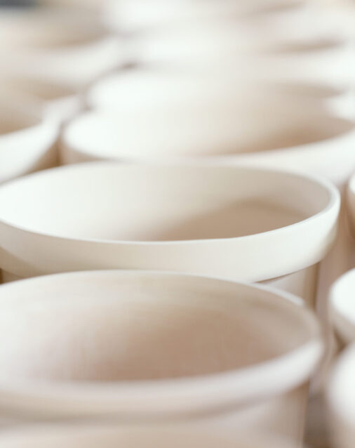 Plain handmade ceramics with soft pastel color toned.Macro shot with soft focus and very shallow depth of field, some objects out of focus.